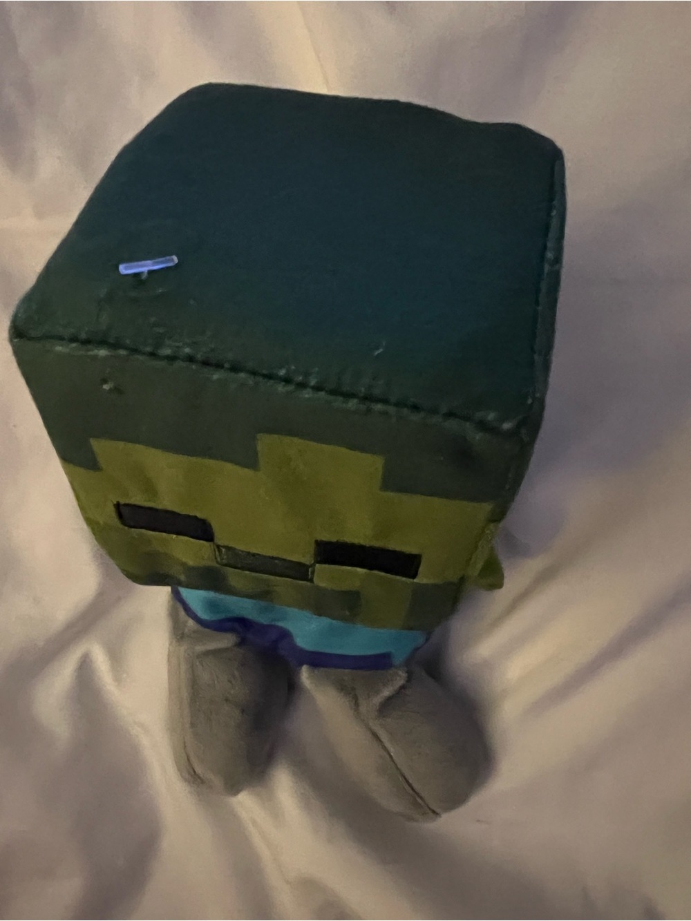 This plush toy is a Jinx Minecraft Mini Crafter zombie.
